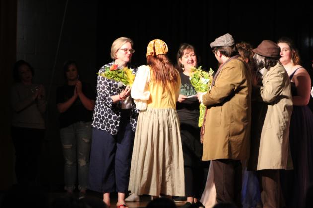 Lillian Effinger and Jadon Jackson give flowers to Choir Director Cheryl Blankenship and Assistant Director Jill Rother.