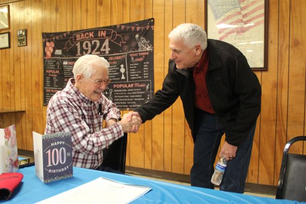 Shawnee Mayor Ed Bolt, right, wishes Noah "Sonny" Hines a happy 100th birthday at the Veterans of Foreign Wars Post 1317, Feb. 5. Hines said he has also had parties at his church and with his fellow "railroaders," and his family and friends will be celebrating at a Shawnee restaurant on Feb. 18. Countywide & Sun/Natasha Dunagan