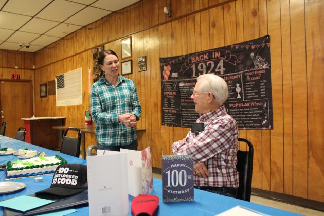 Army veteran and State House of Representatives Candidate Kerri Keck wishes Noah "Sonny" Hines a happy 100th birthday and speaks with him during a birthday party in his honor at the Veterans of Foreign Wars Post 1317, Feb. 5. Countywide & Sun/Natasha Dunagan