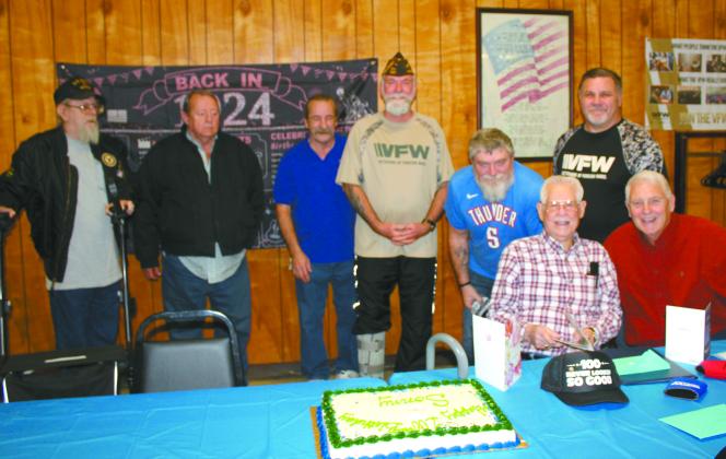 Noah "Sonny" Hines, seated with card, celebrated his 100th birthday at the Veterans of Foreign Wars Post 1317 in Shawnee on Feb. 5. Those in attendance included, from left, VFW Post Chaplain Danny Brown, VFW Member Wayne Linn, VFW Senior Vice Commander Don Plumley, Post Commander Patrick Koch, VFW Quartermaster James Wear, Hines, Past Department of Oklahoma Commander James Dockmeyer and Shawnee Mayor Ed Bolt. Countywide & Sun/Natasha Dunagan
