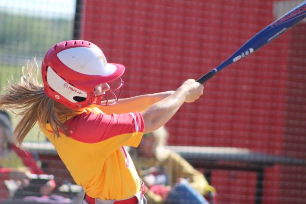 Dale's Heartly Snyder hits a single during the April 22 home game with Class 6A Mustang. In Class 4A, the Lady Pirates slow pitch team lost, 8-17, making their record 29-6. They were scheduled to play in regionals on April 23. Countywide & Sun/Natasha Dunagan