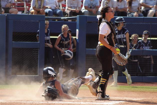 Asher sophomore Sammie Williamson recovers after sliding across home plate in the seventh inning of the Class B Slow Pitch State Quarterfinals.