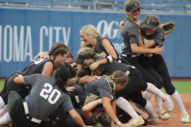 The Tecumseh Lady Savages dogpile after winning the Class 5A State Slow Pitch Softball State Championship. All on April 30, they won the Quarterfinals with Bristow, 14-10; the Semifinals with North Rock Creek, 13-7; and the Finals with Washington, 9-6. See more photos in the next issue. Countywide & Sun/Natasha Dunagan