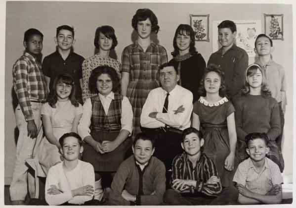 Former New Hope School student Beverly (Reaves) Kieffer said Mr. Lee Nevilles was one of her favorite teachers. He taught from 1962-1968. Shown, front row from left, are J.W. Miner, Ricky Timperley, Eddie Sherwood, Terry Dodson, middle row, Dorthy Annanders, Cindy Wiggins, Nevilles, Viola DeWitt, unknown, back row, Rocky Blanchard, Charles Annanders, Cathy Carpenter, Debbie Chastain, Ethel Dodson, Harold Yates and Willie Carpenter. Photo from the Collection of Glenn Dale and Kathryn Carter.