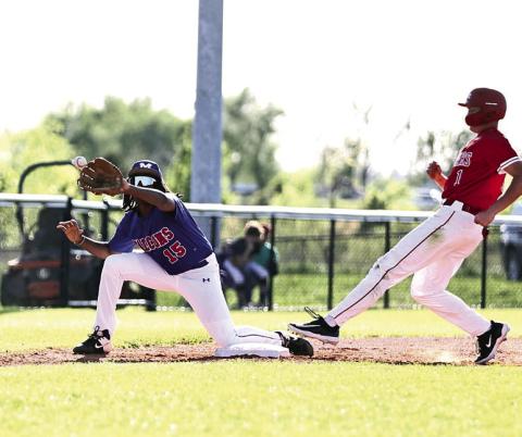 Pictured left, North Rock Creek’s Gus Snodgrass beats the throw to arrive safe at third base. Photo courtesy of Gowin Photography